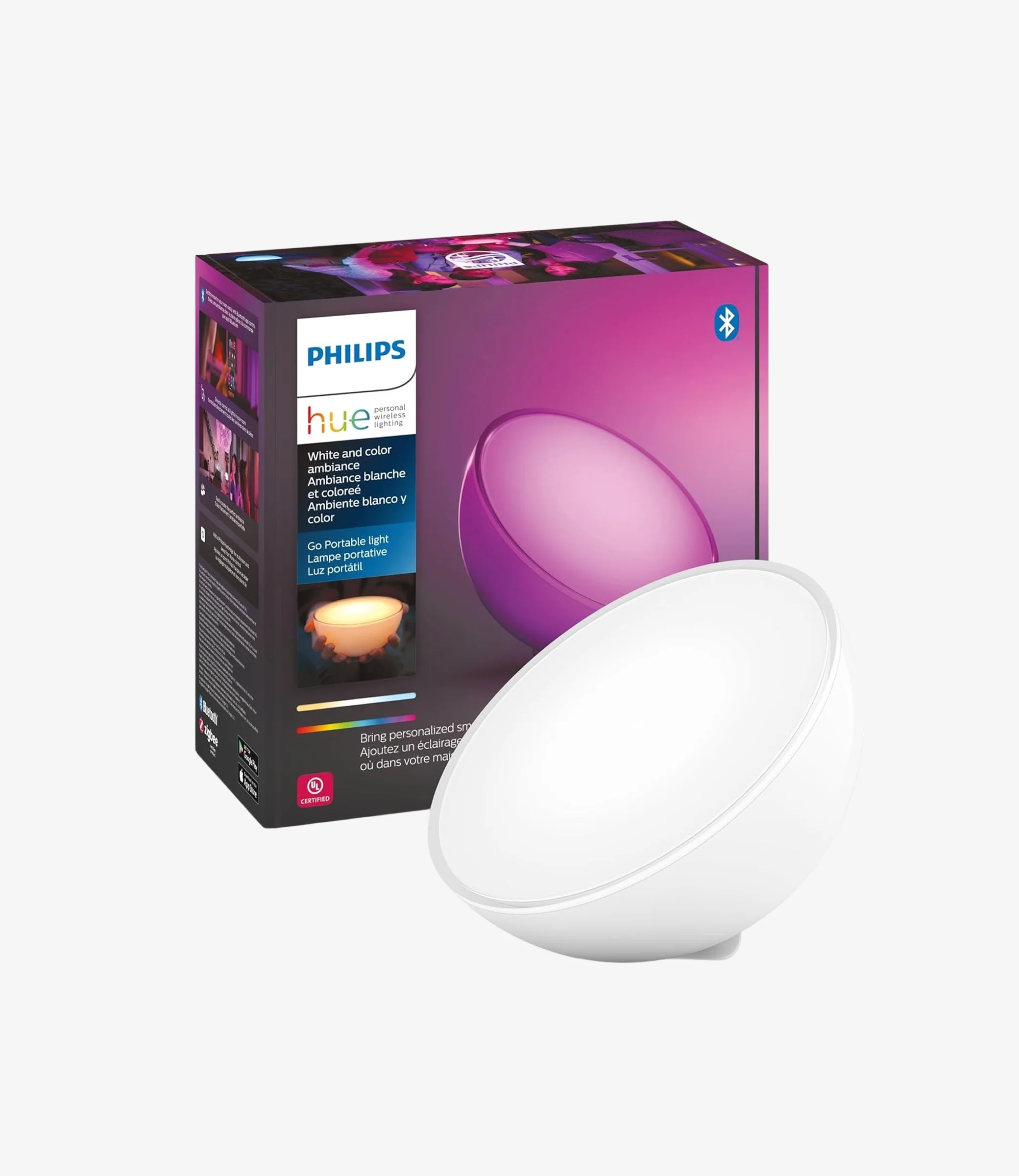 Philips Hue portable light in front of its box. The box features a colorful hue effect. Keywords: Philips, Hue, portable light, ambient, color.