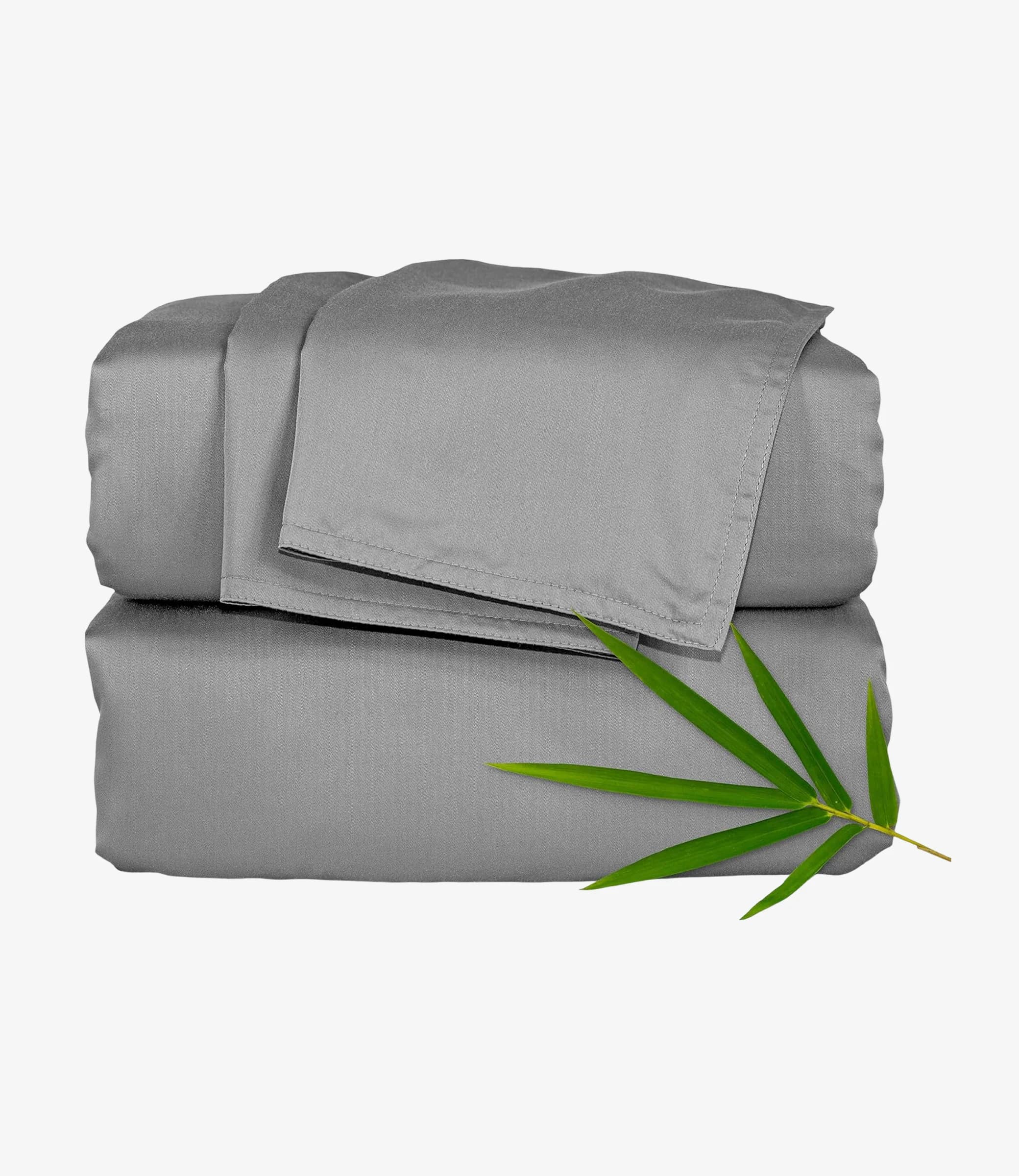 Gray bamboo sheet set neatly folded with a green bamboo leaf accent on top. The set conveys a sense of softness and eco-friendliness.